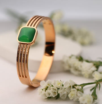 GREEN STONE STUDDED PINK GOLD PLATED BRACELET